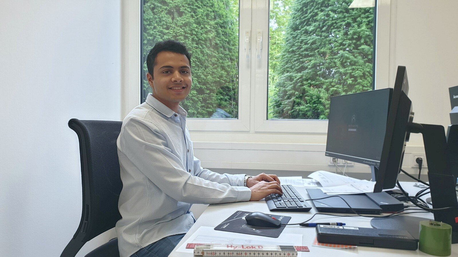 Mr. Jain at his desk in Schwind production